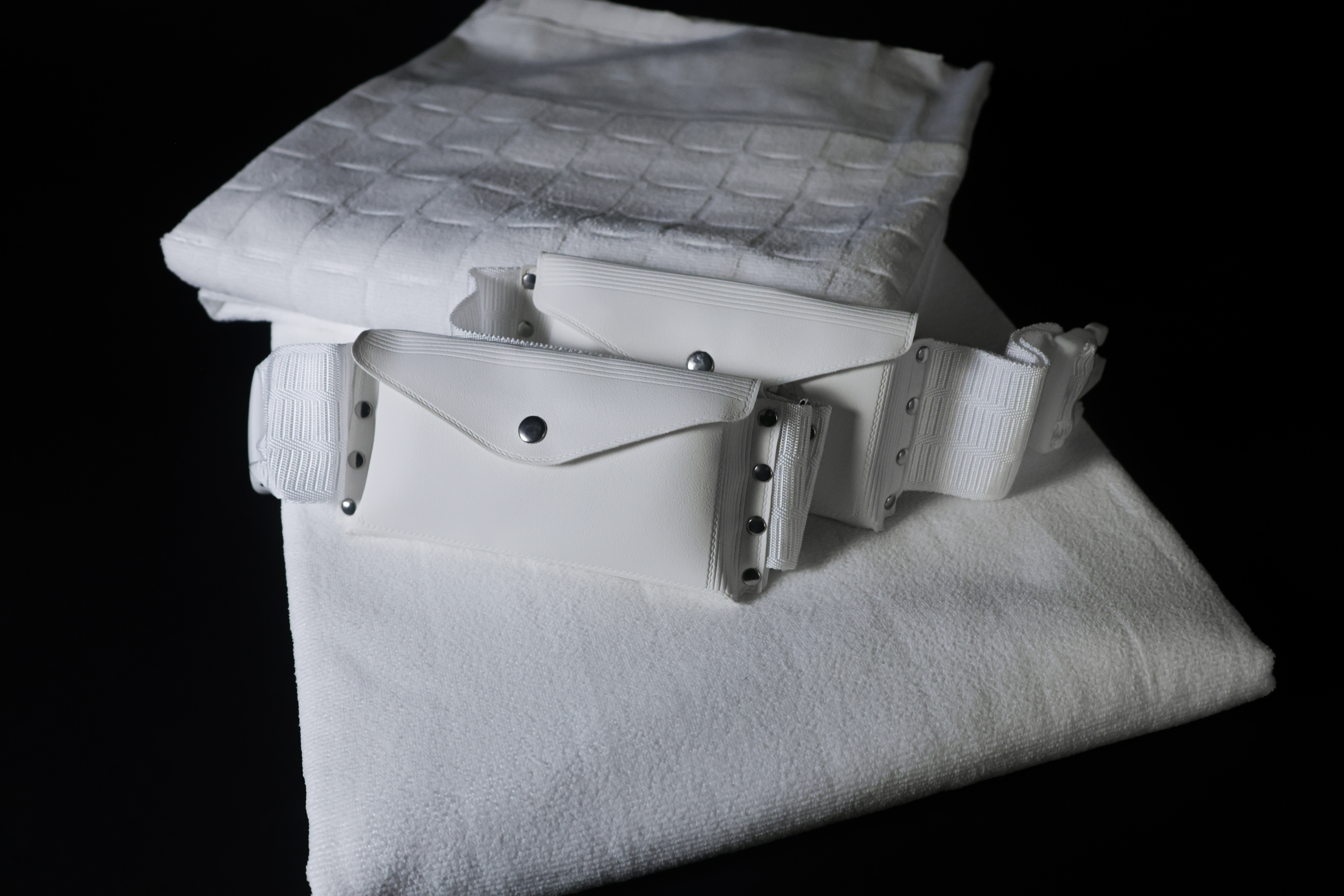 Belt on ihram towel — angle view