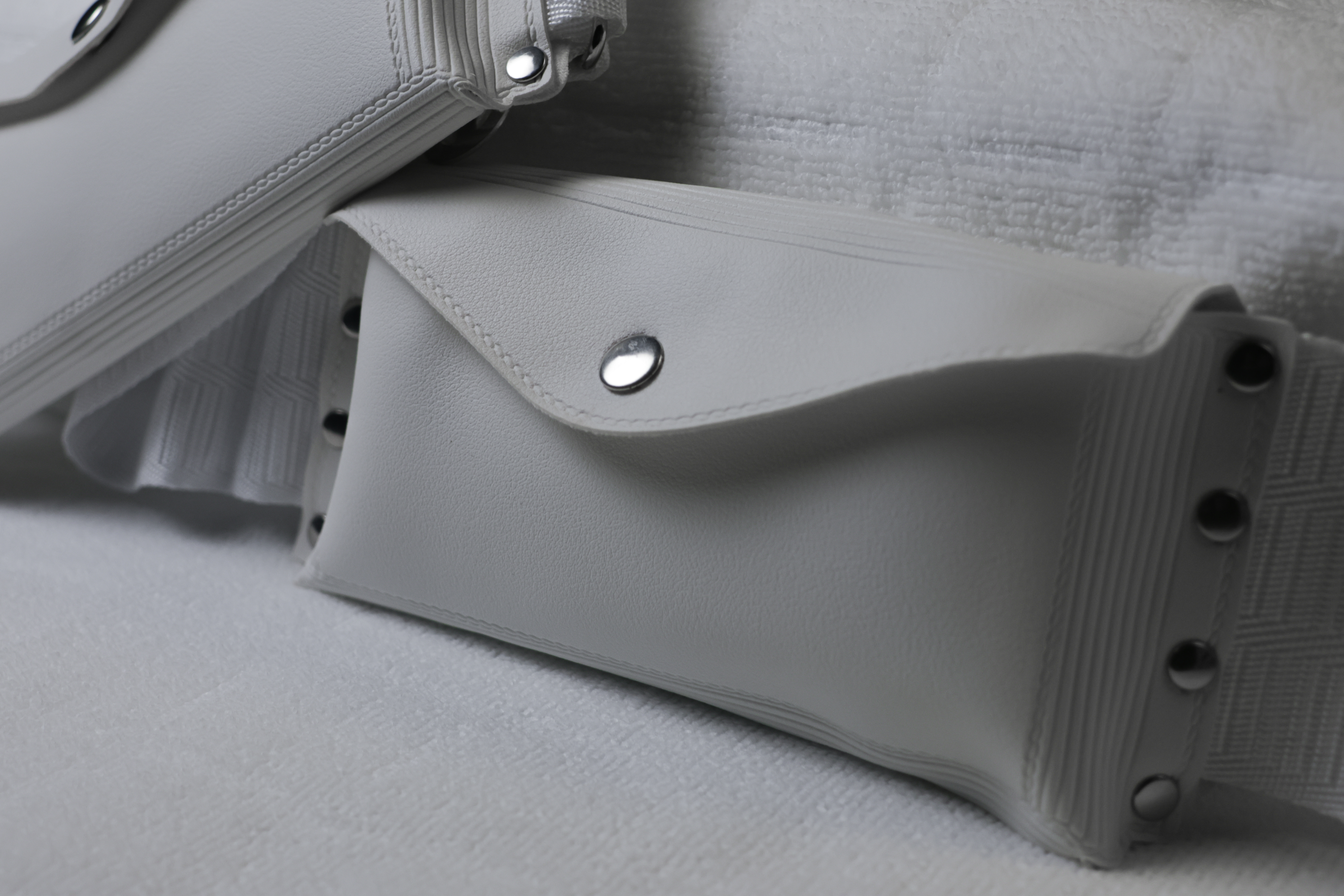 Pouch closeup — snap button detail